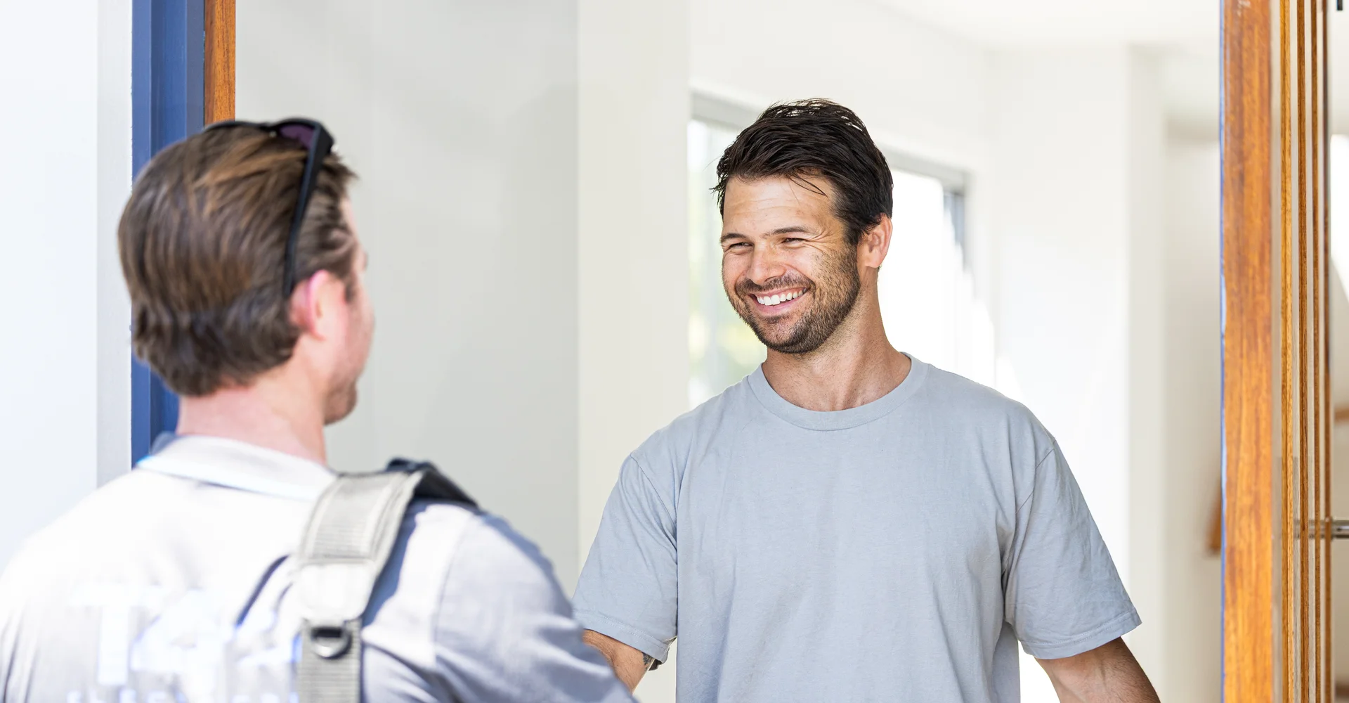 Technician greeting a local homeowner